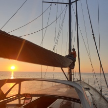 José unfurling the main sail